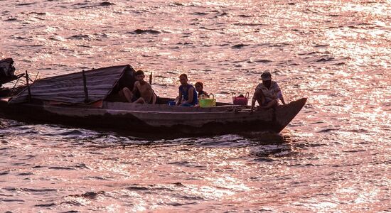Panoramic view of Chiang Khong’s Mekong shores for a scenic Chiang Khong Tours banner by Legend Travel Group.